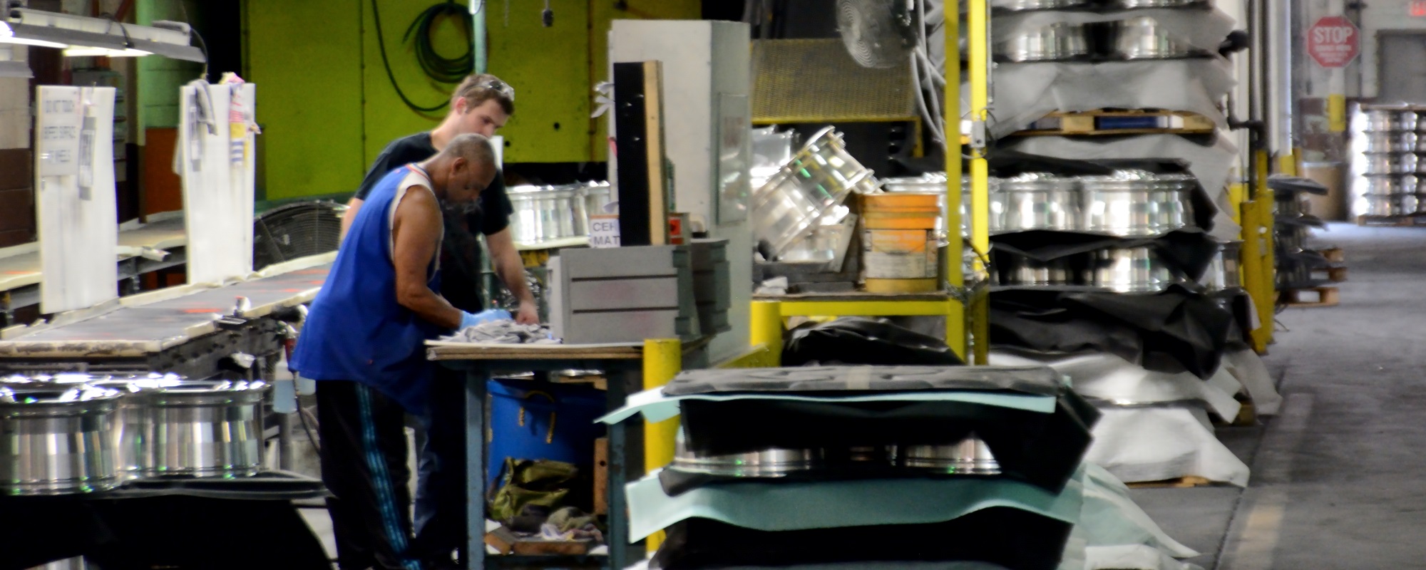 AMT employees working together in manufacturing facility