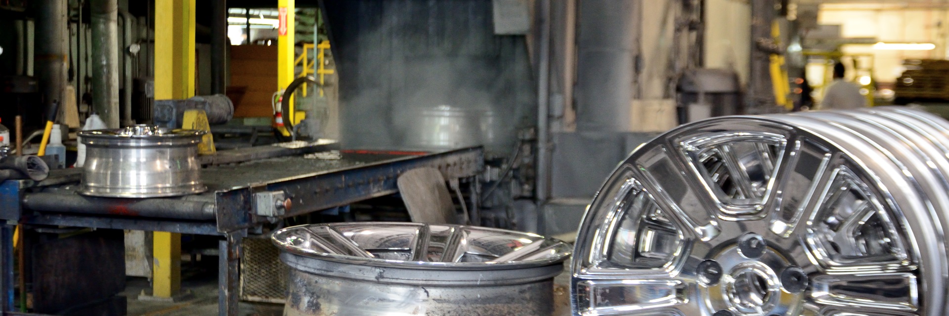 Wheels waiting to run through automatic washing and degreasing machine