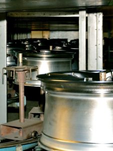 Wheels enter cooling chamber after liquid paint was applied